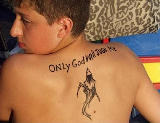 Failed tattoo - misspelled tattoo on the back