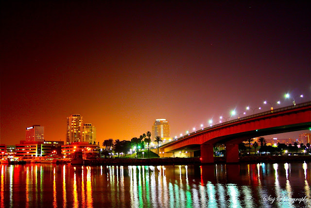 The Queens Way Bridge at Queen Mary at Long Beach, California, Downtown. Colorful Night at Palm Beach Park at the marina in Long Beach. Long Beach Skyline. Queensway Bay 