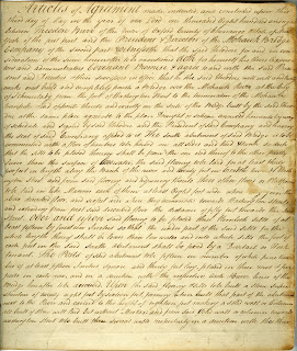 Yellowed piece of paper with cursive lettering in ink covering the whole page. The edges of the page are turning brown from old age and there are faint stains and marks throughout covering some of the words.