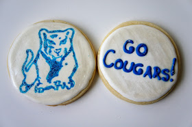 Custom hockey themed, jersey, ice skate, hockey stick and puck, logo, hand decorated sugar cookies, by Askanam. Find me on Etsy to order your custom cookies!