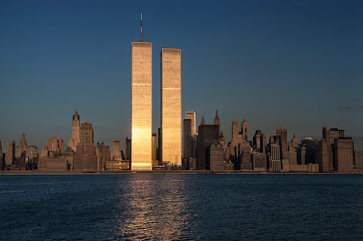 color photograph of a glowing sunset portrait of the twin towers of the World Trade Center from 1979