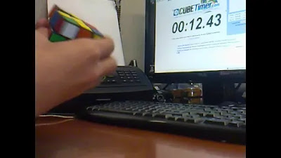 A person practicing F2L algorithms with a Rubik's Cube timer, emphasizing the importance of consistent practice - Conquer the Cube: Mastering F2L Algorithms for Rubik's Cube