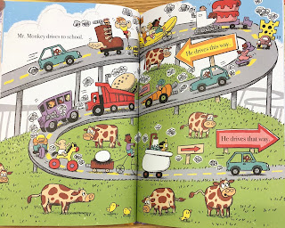 A two-page spread depicting a busy elevated highway passing a cow pasture. Text reads "Mr. Monkey drives to school. He drives this way. He drives that way."