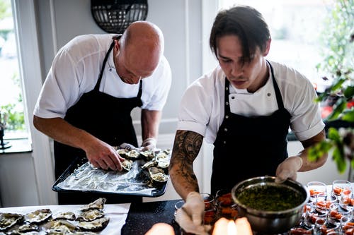 Two chefs preparing a weight loss dish.