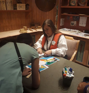 EPCOT Kidscot Passport getting it stamped at Norwar Pavilion