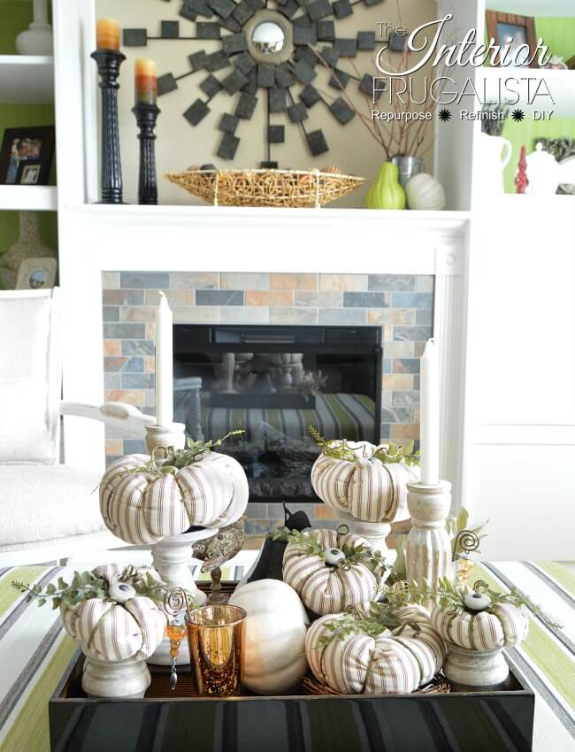 Here I show you how to salvage an old ticking stripe slipcover and kitchen cabinet knobs into pretty fabric pumpkins with farmhouse style for fall.