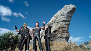 A group photo of Noctis and his bros in front of a fancy rock.