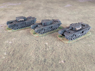 Three Churchill Mark III tanks