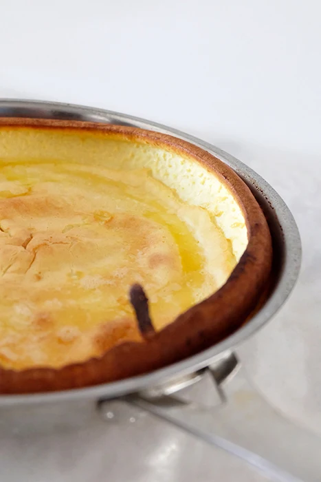 close up of pan edge of freshly baked dutch baby