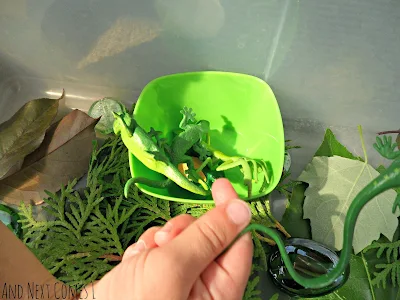 Sorting green creatures in a green sensory bin from And Next Comes L