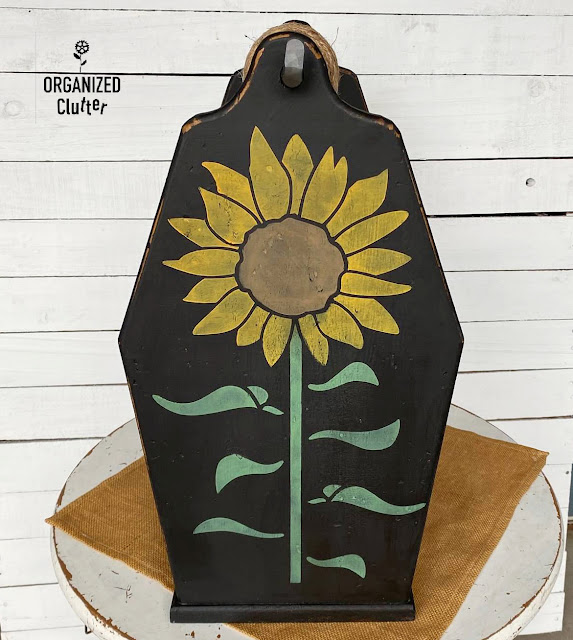 Photo of the sunflower stenciled ends of an upcycled tote.