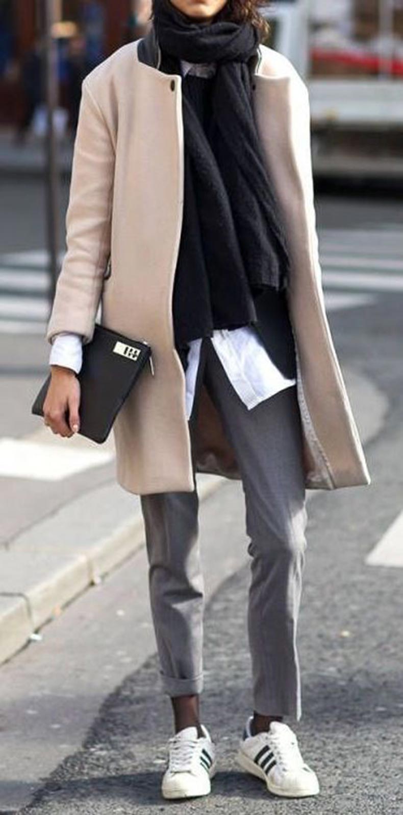 cool layered outfit idea / sneakers + grey pants + beige coat + scarf + shirt + clutch