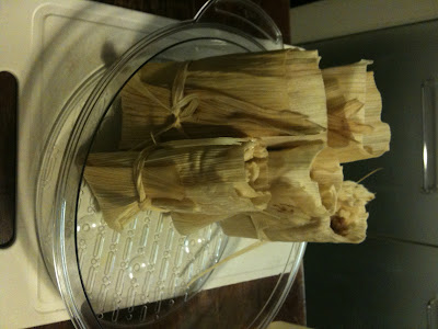 tamales in corn husks in steamer