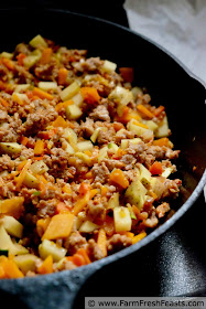 cooking the sausage and finely chopped vegetables for the sausage pasty filling