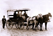 'Abdu'lBaha and friends in horsedrawn carriage