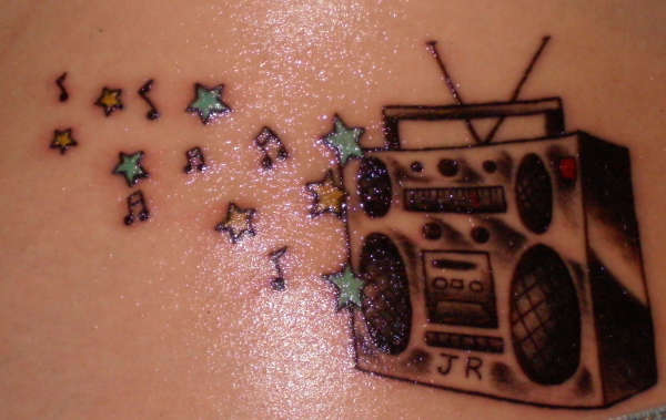 tattoos with stars. music note tattoos.