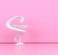 white snake on a pink background