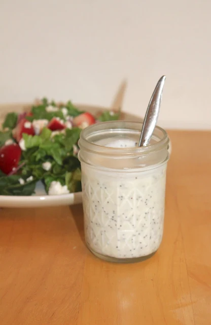 Jar of creamy poppy seed dressing.