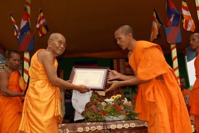 Mai Samoeun is a Director and Head Monk (on the right)