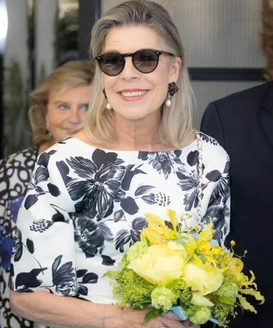 Princess Caroline wore a Kora floral-print faille maxi dress by Emilia Wicksead. Pearl earrings and Chanel white leather bag