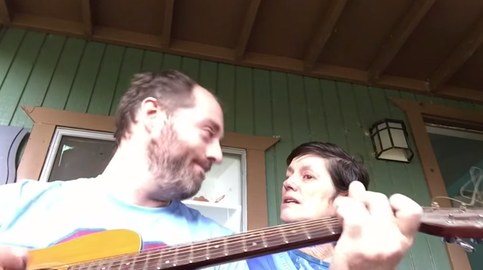 Mother with Alzheimer's Comforted by Son's Guitar Tune