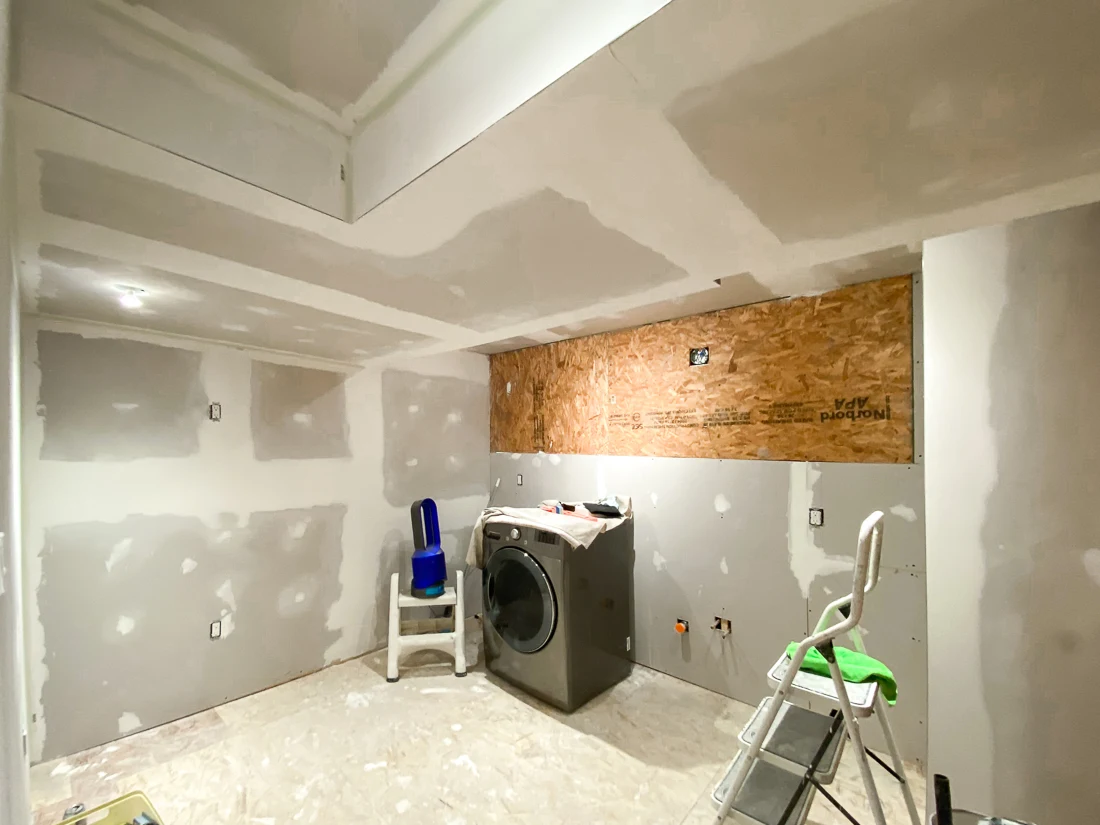 basement laundry room renovation, laundry room remodel, diy drywall installation