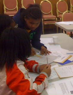 Students in Laurel, MD analyzing evidence as part of 