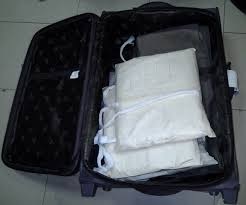 Drug Trafficking NDLEA arrests woman with cocaine hidden behind her luggage handle