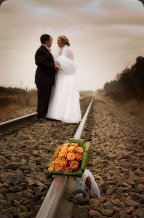 Bride and groom on railroad tracks- Joretha Taljaard Wedding Photography