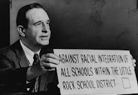 Arkansas Governor Orval Faubus 1957, refuses to desegregate Little Rock schools holding up sign