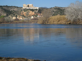 Miravet Castle reflected in Ebre river