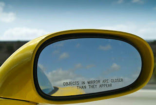 OBJECTS IN MIRROR ARE CLOSER THAN THEY APPEAR