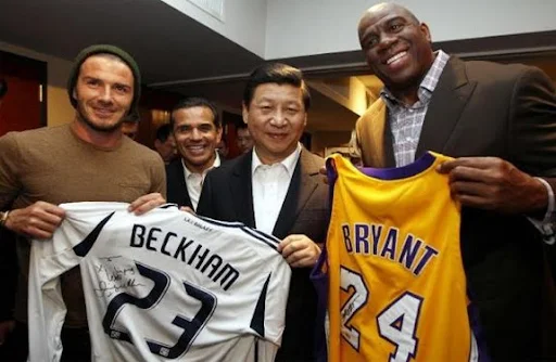 Next Chinese president Xi Jinping is presented with jerseys by David Beckham and Magic Johnson