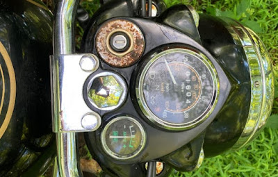 Close up for Royal Enfield motorcycle with rust on dashboard.