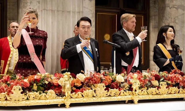 Queen Maxima wore a Lissie silk velvet gown by Costarellos. First Lady Kim Keon Hee wore a black satin gown