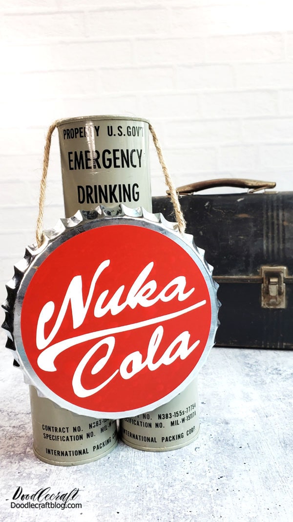 Now your Nuka Cola Bottle Cap is ready to display with your Emergency Drinking Water and Dusty Mole Miner Pail!  It's the perfect handmade gift for a fellow Fallout gamer and would be a great addition to a party!    This bottle cap idea could be adapted to another favorite soda, beer or bottlecap drink too! What's your favorite beverage with a cap?