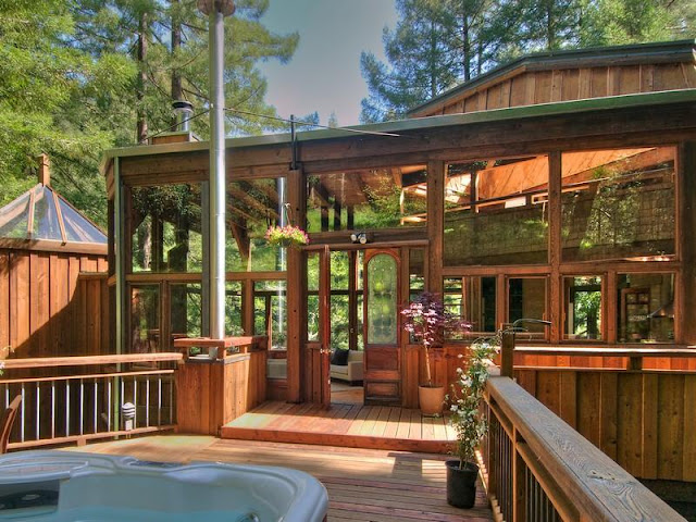 Photo of entrance into the tree house in the forest as seen from the terrace