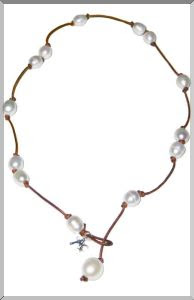 freshwater pearls anchored on knotted mocha leather
