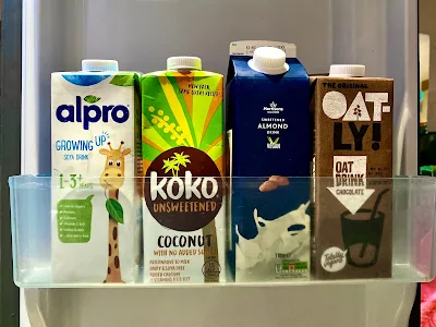 vegan milk in a fridge door