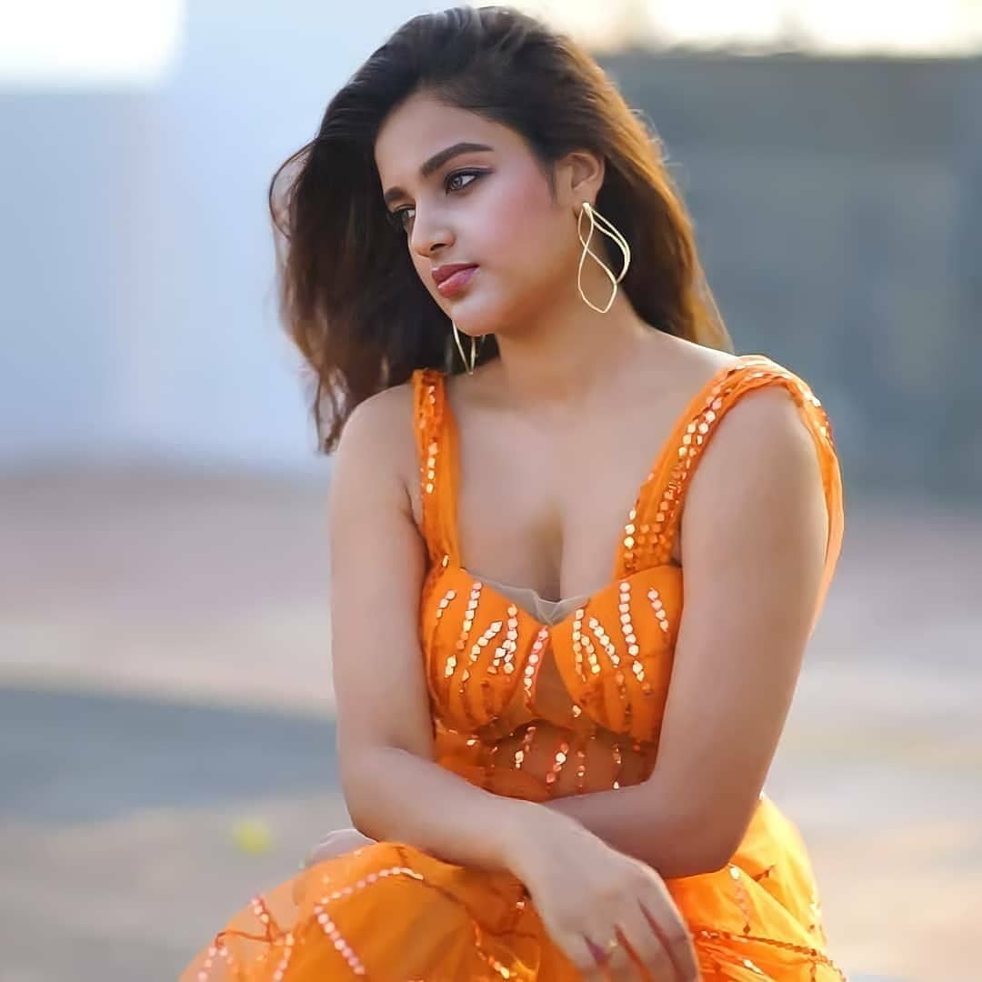 Actress Nidhhi Agerwal Latest Photoshoot Stills in Orange Dress