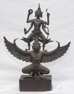Garuda, Vishnu's mount and the eternal enemy of serpents; stone carving from South-East Asia. 