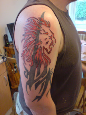 tribal tattoo tree. Red Tribal Lion Tattoo [Image Credit: Link]