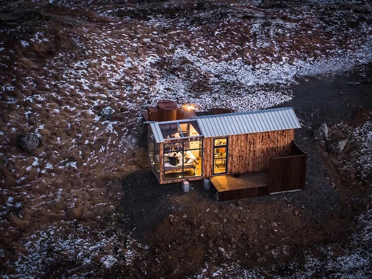 Cabin With Glass Walls In Iceland Lets Visitors Gaze At The Northern Lights While Laying In Their Bed