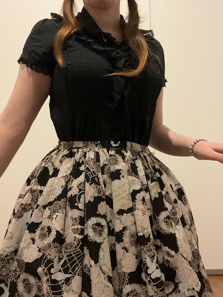 lolita outfit with a corset worn under