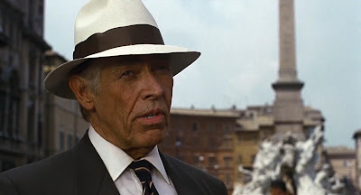 CIA agent George Kaplan (James Coburn) enjoys murder,
misses the Cold War, and looks forward to his pension.