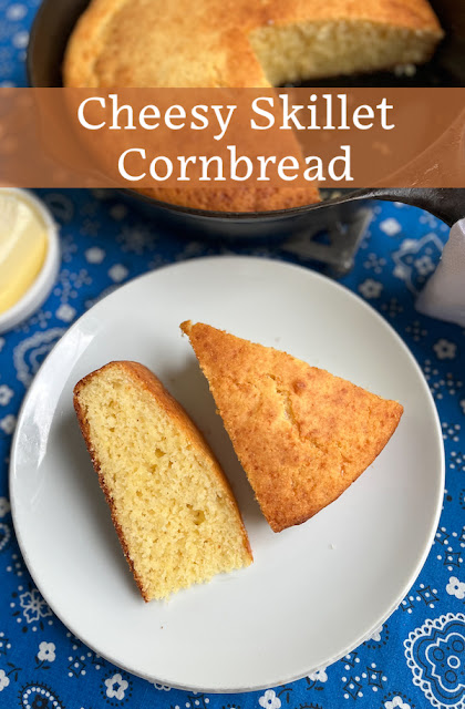 Food Lust People Love: This cheesy skillet cornbread has a crunchy bottom and a tender cheesy crumb. It is the perfect accompaniment to your favorite soup or barbecue meal!