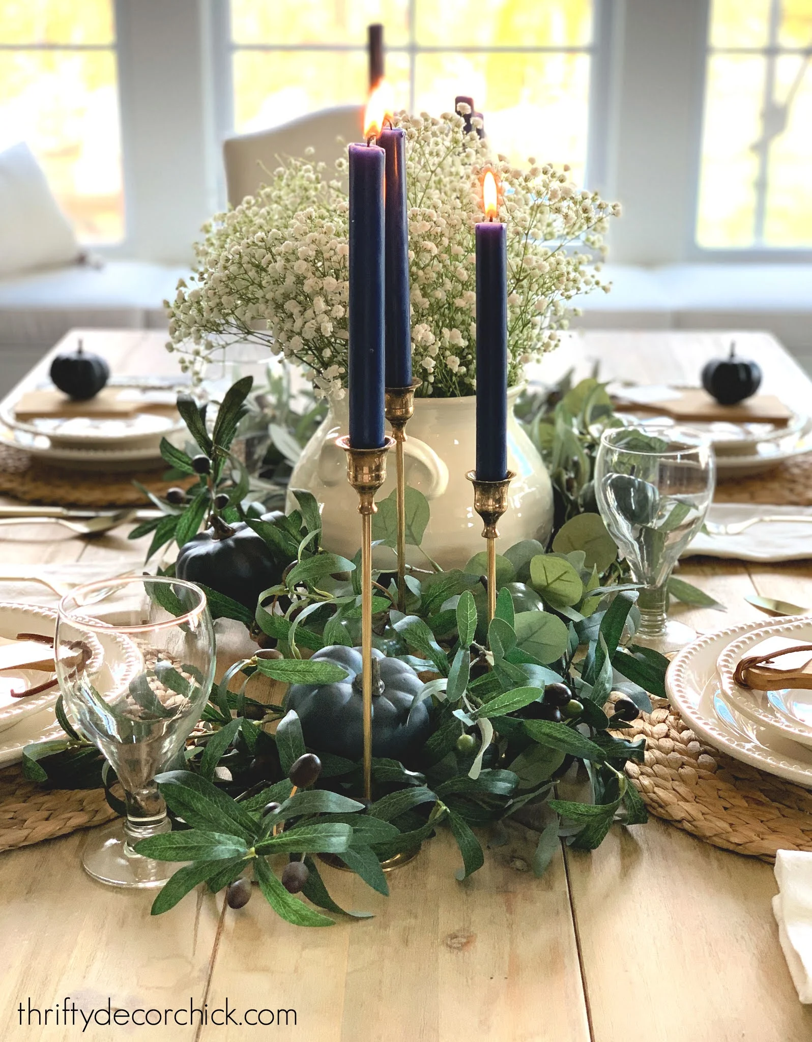 brass candlesticks blue candles tablescape