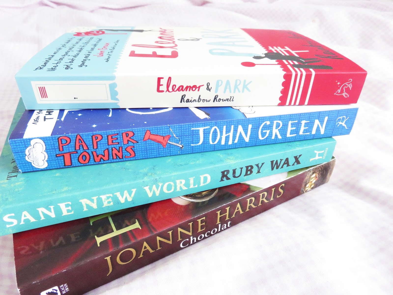 books, stack of books, eleanor and park, rainbow rowell, paper towns, john green, sane new world, ruby wax, chocolat jonanne harris