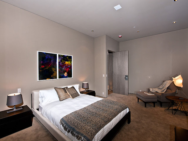 Photo of one of the modern bedrooms in the luxury modern Hollywood house