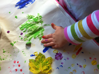 child finger painting